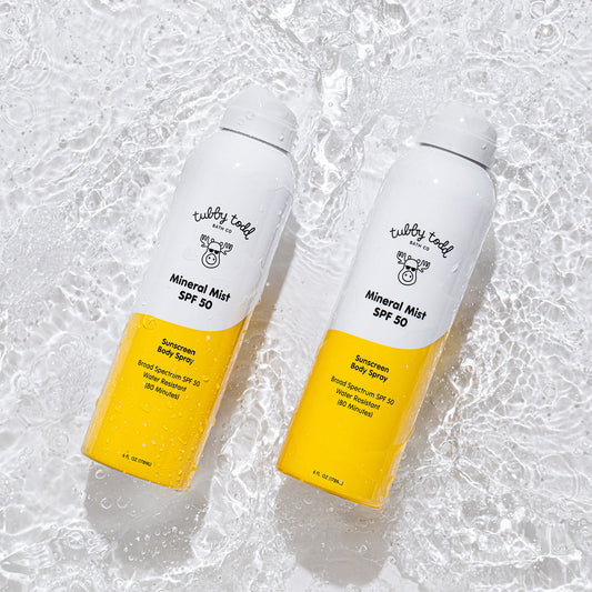 2 of Mineral Mist spray bottles floating on the water.